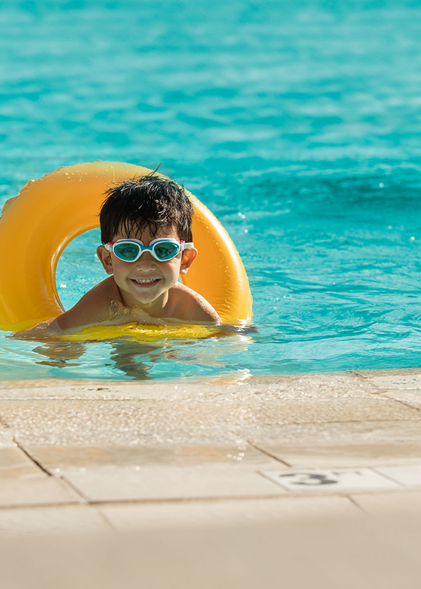 Kids enjoying The Grand America's outdoor pool in Salt Lake City