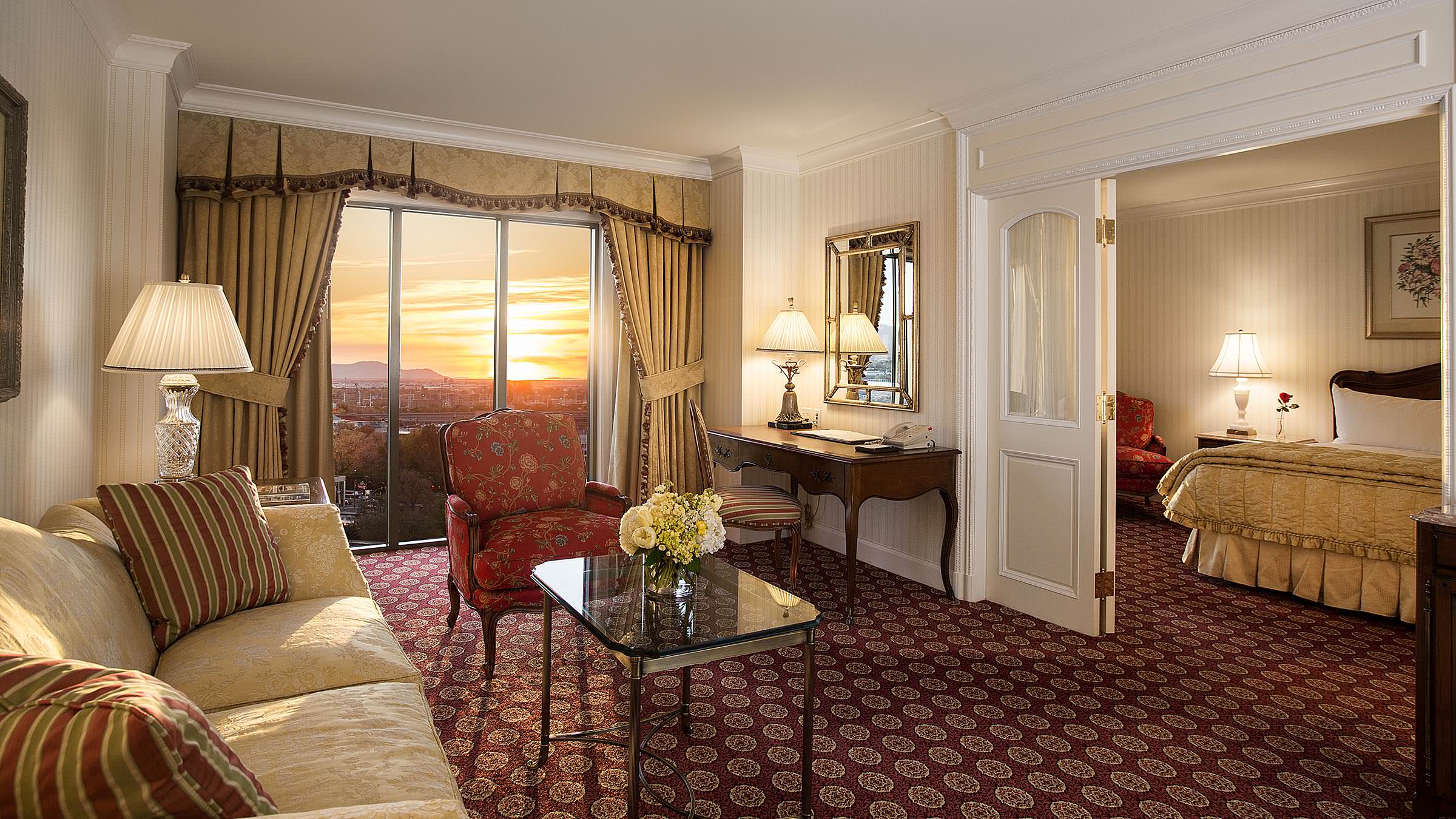 Grand America Hotel executive suite guestroom with handcrafted wood furniture.