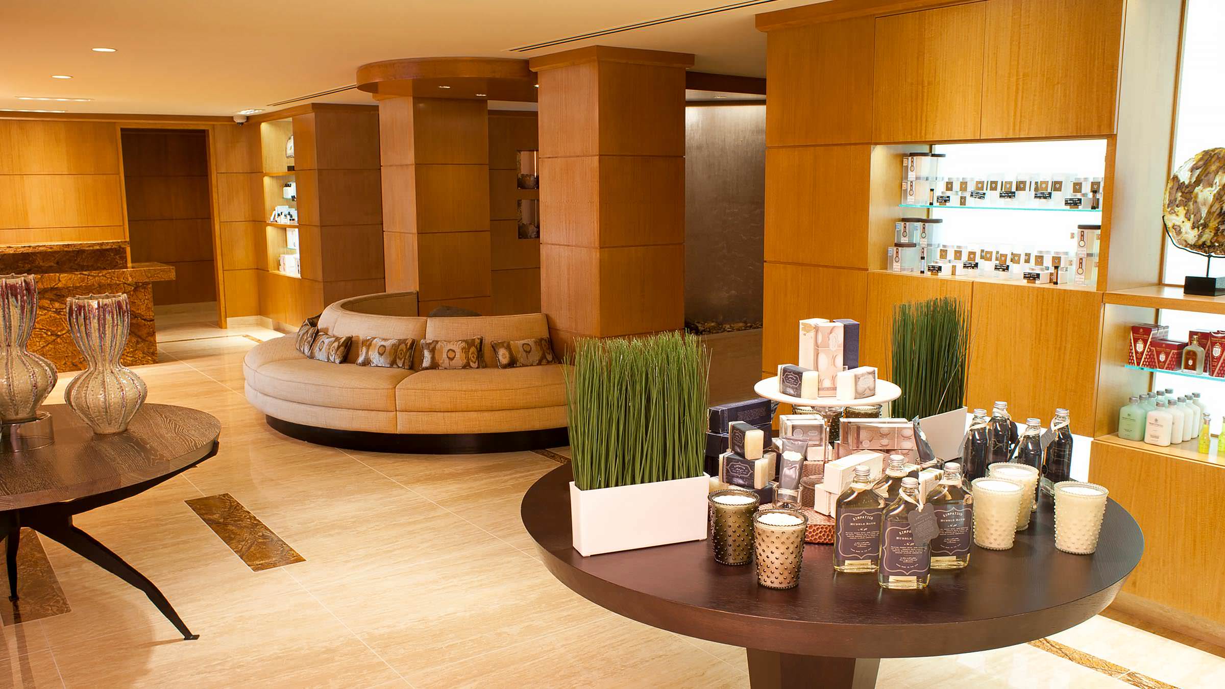 Grand Spa retail space with waiting area, water feature, and spa products.