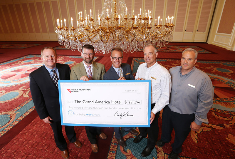 Rocky Mountain Power wattsmart project team in The Grand Ballroom at The Grand America Hotel celebrating the completion of a recent energy project.