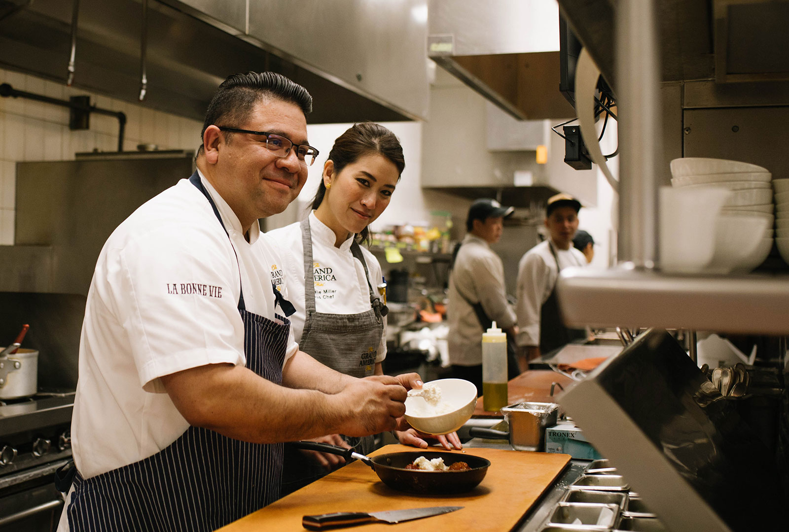 The Grand America Hotel Kitchen with two chefs cooking