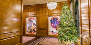 Hallways of The Grand America Decorated with Christmas Window Displays and Tree
