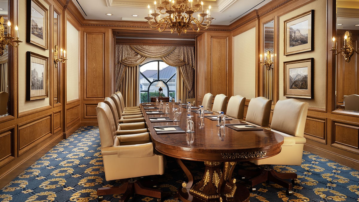 Embassy boardroom at the Grand America Hotel with a custom Italian board table and a view of the Center Courtyard.