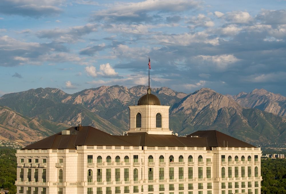 The top of The Grand America Hotel with the Wasatch Mountains