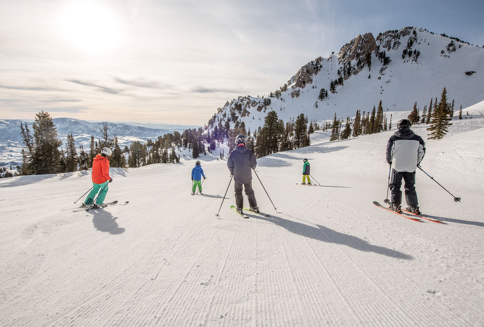 Skiers at Snowbasin Resort in Utah