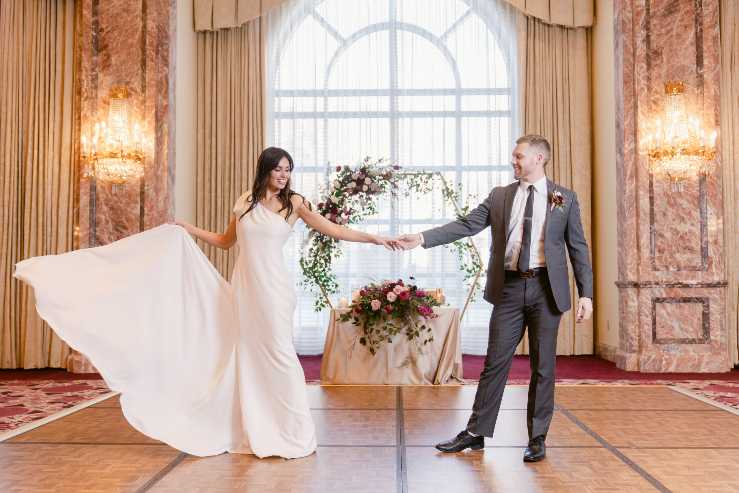 Bride and Groom have their first dance on a dance floor set up in the center of the Grand Salon.
