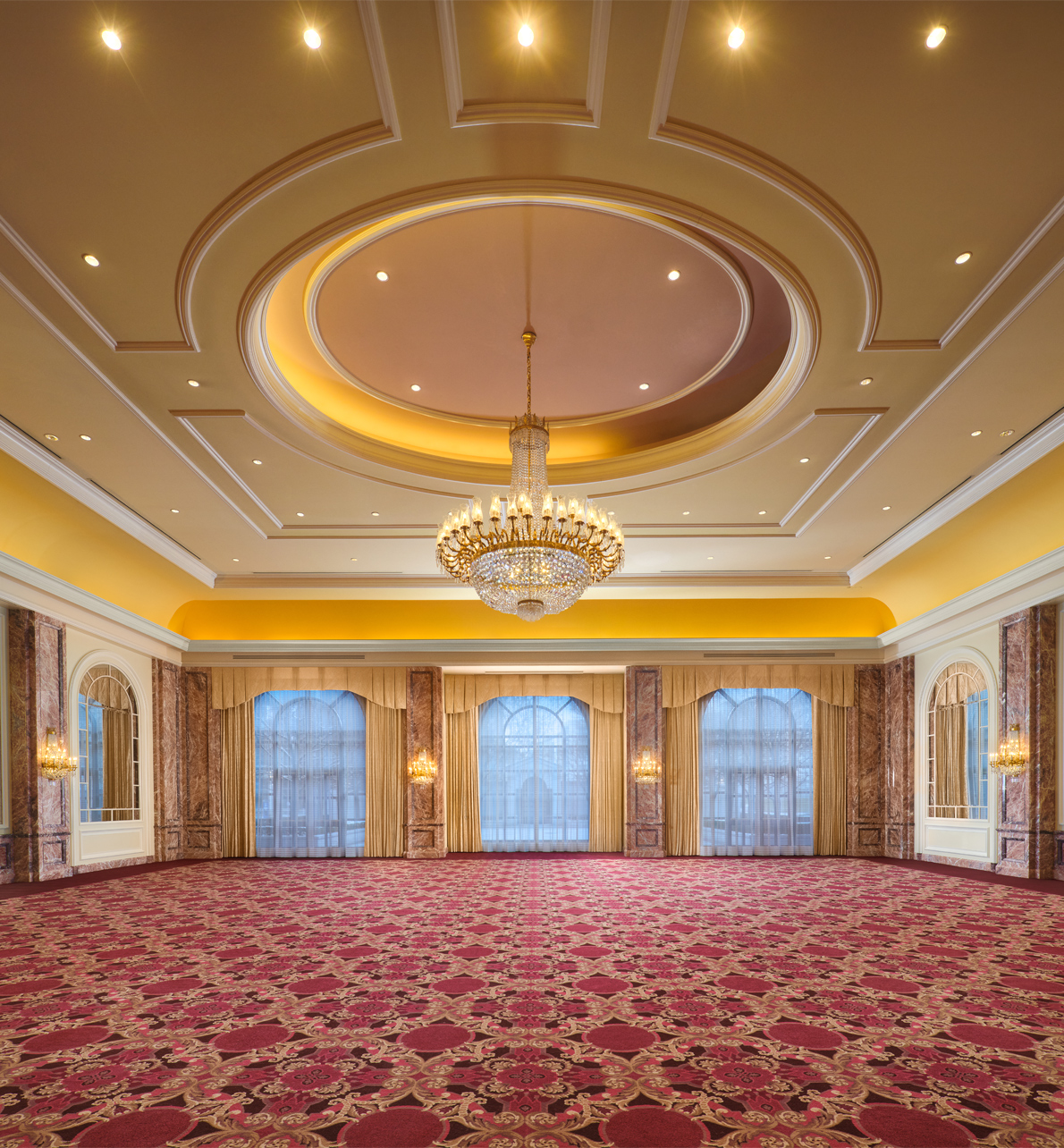 The Grand Salon meeting space with a large center chandelier at the Grand America Hotel