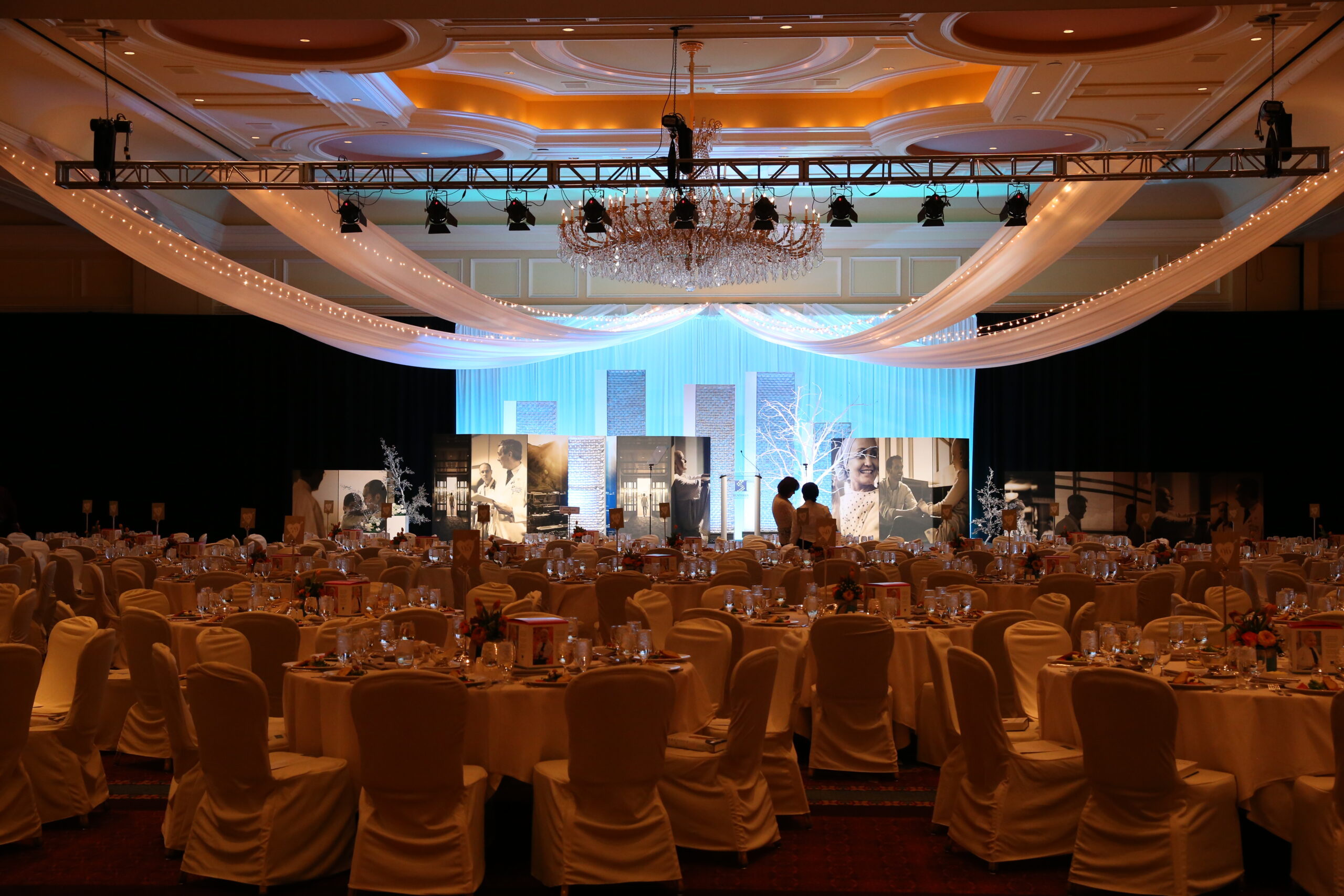 A complete event set-up with lighting, seating, displays, and décor